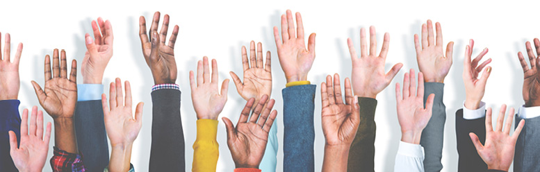 Raised Hands graphic This image shows a variety of hands being raised to volunteer